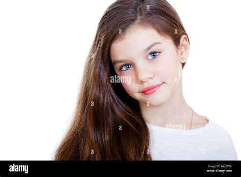 Portrait Of A Charming Little Girl Smiling At Camera Isolated On White