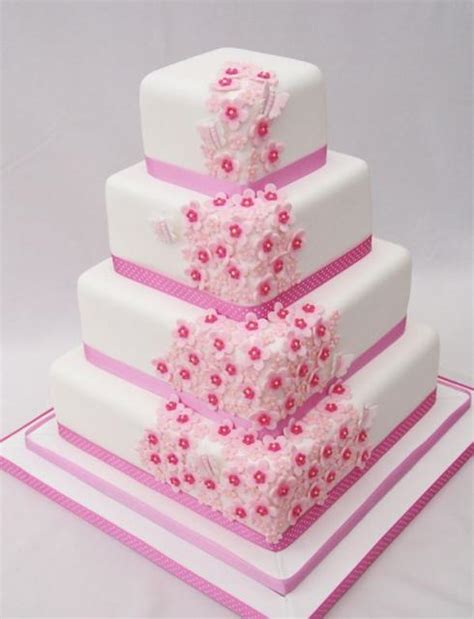 Four Tier Square White Wedding Cake With Pink Flowers And