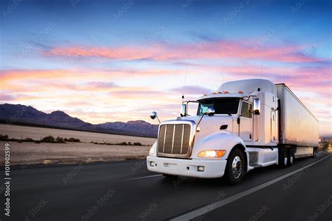 Truck And Highway At Sunset Transportation Background Stock Photo
