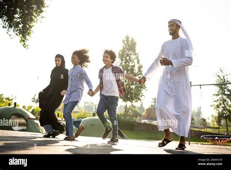 Cinematic image of a family playing at the playground in Dubai Stock