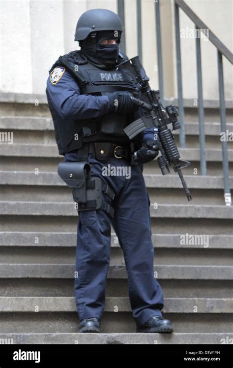 Dpa Files A Heavily Armed And Masked Policeman Guards The Federal