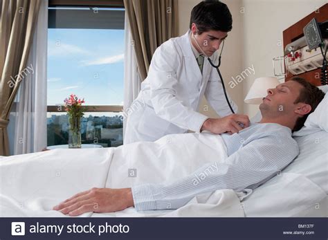 Doctor Examining A Patient Hi Res Stock Photography And Images Alamy