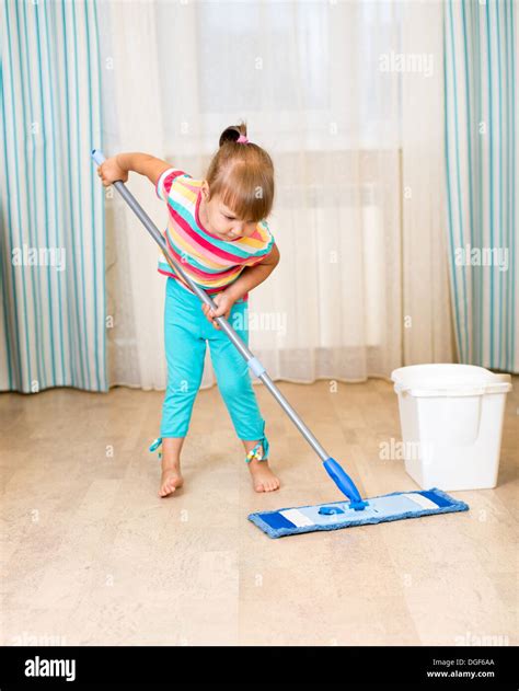 Kid Girl Doing Her Room Cleaning Room With Mop Stock Photo Alamy