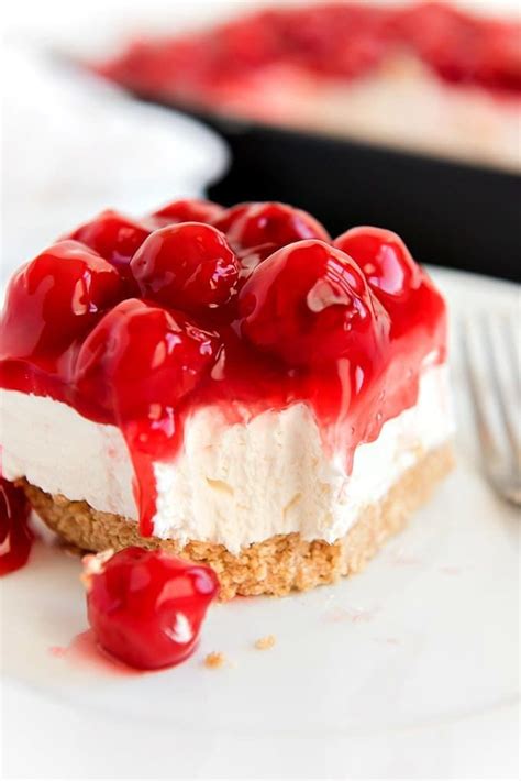Slice Of No Bake Cherry Cheesecake With Bite Gone Out Of It No Bake