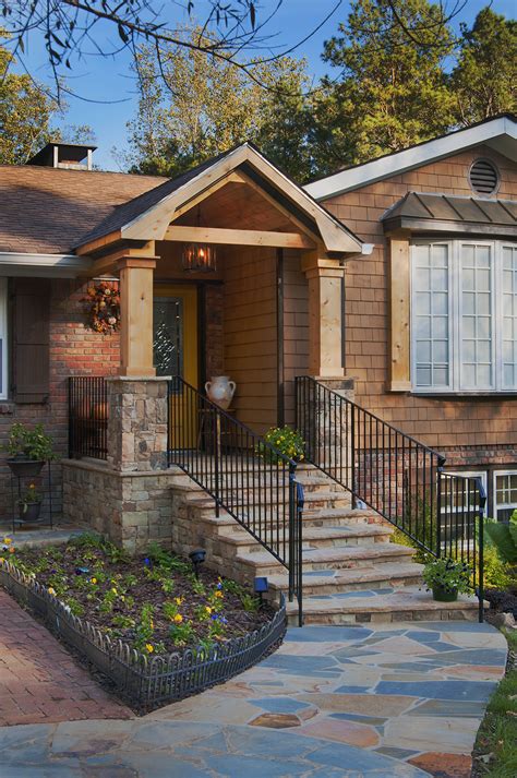 Very common imo to cut this corner and skip the proper support. Timber portico with stone piers, steps and walkway ...
