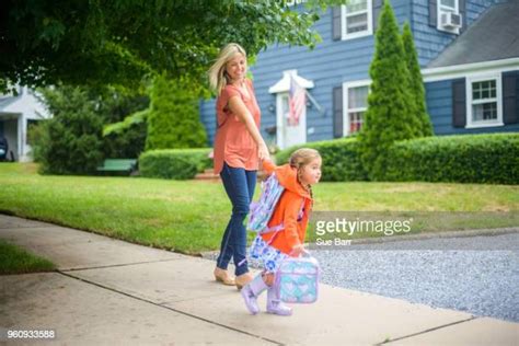 Mother And Daughter Go To School Photos And Premium High Res Pictures