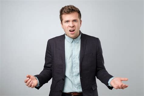 Premium Photo Confused Angry Young Elegant Man Gestures In