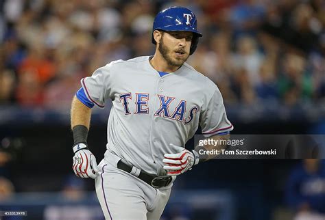 Jp Arencibia Of The Texas Rangers Runs To First Base As He Hits A