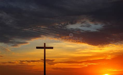 Silhouette Of Christian Cross Over Red Sunrise Or Sunset Stock Photo