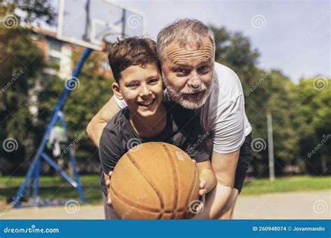 Mature Man Playing Basketball With His Son Stock Photo Image Of