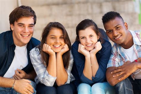 Portrait Of Happy Highschool Students Outdoors Snowman Software