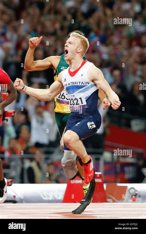 Jonnie Peacock Of Great Britain Celebrates Winning Gold Following The