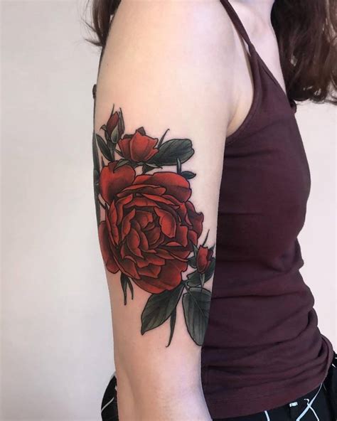 Red Rose Tattoo On The Upper Arm