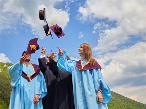 Group Of Students In Graduation Gowns And Caps Stock Image Image Of