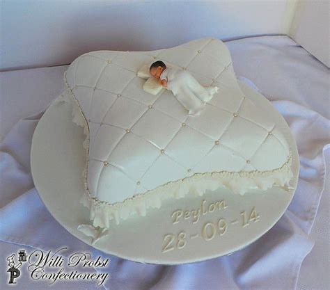 Rest your eyes on our poised pillow cakes and dream of the perfect wedding. Pillow themed baptism cake with fondant baby topper in ...