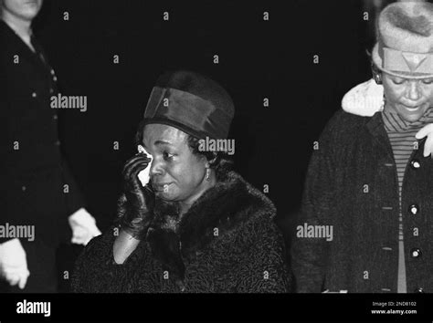 Americans pay homage to their fallen leader, John F. Kennedy, as he