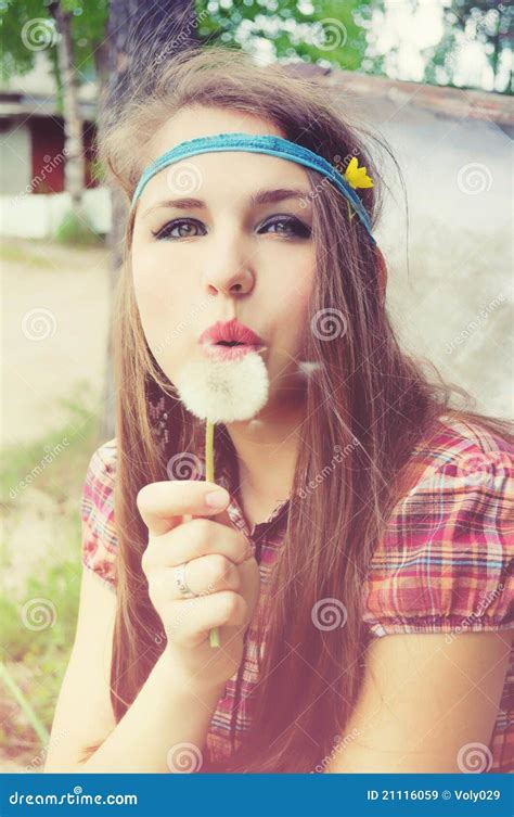 girl blowing a dandelion stock image image of hippie 21116059
