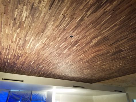 Amazing gallery of interior design and decorating ideas of wood panel ceiling in bedrooms, living rooms, dens/libraries/offices, dining rooms, kitchens, entrances/foyers, media rooms by elite interior designers. Wood Paneling Creates Warm Texture | Building Your Library