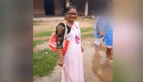 Viral Video Odisha Teacher Standing With Stick Makes Students Clean