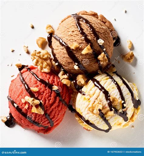 Three Scoops Of Ice Cream Drizzled With Chocolate Stock Image Image