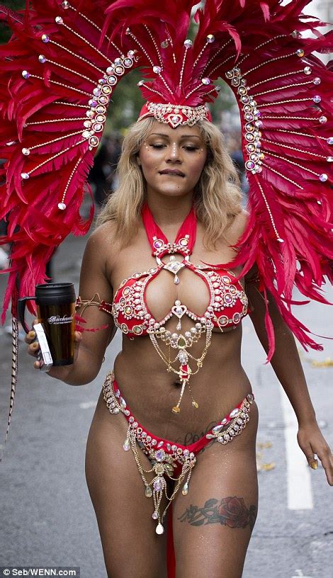 Notting Hill Carnival Revellers Refuse To Let The Rain Put A Dampener