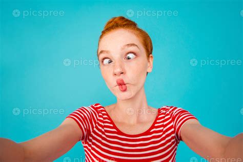 Free Self Portrait Of Crazy Foolish Playful Pretty Ecstatic Cheerful Red Haired Girl With Bun