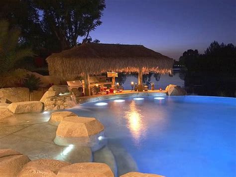 I Love The Tiki Hut And Rocks Into A Pool Dream Backyard Beautiful