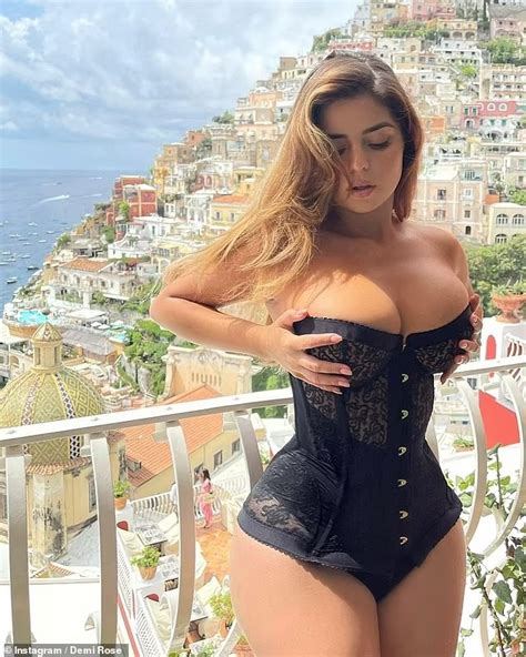 Demi Rose Flaunts Her Very Ample Cleavage In A Racy Black Corset As She Soaks Up The Sunshine On