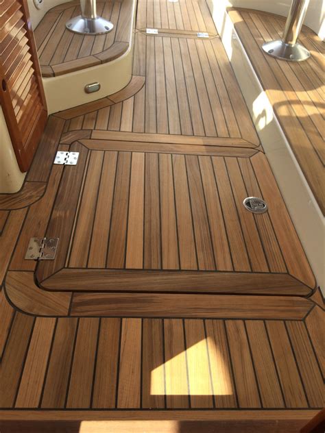 The Inside Of A Boat With Wooden Flooring