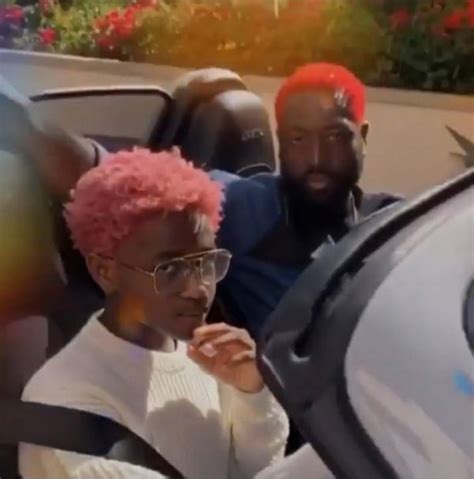 Dwyane Wade Debuts Bright Red Hairstyle While Stunting With Zaya