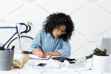 Attractive Young African American Female Accountant Wearing Blue Shirt