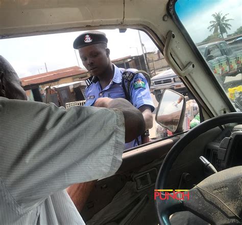 Photos Policeman Caught On Camera Collecting Bribe Punch Newspapers