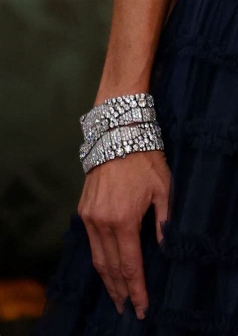 A Womans Hand With Two Bracelets On It