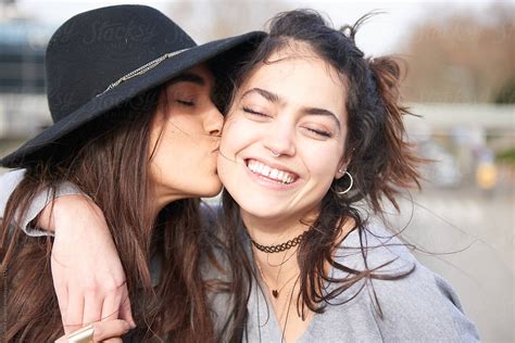 View Loving Millennial Women Kissing On Street By Stocksy Contributor Guille Faingold Stocksy