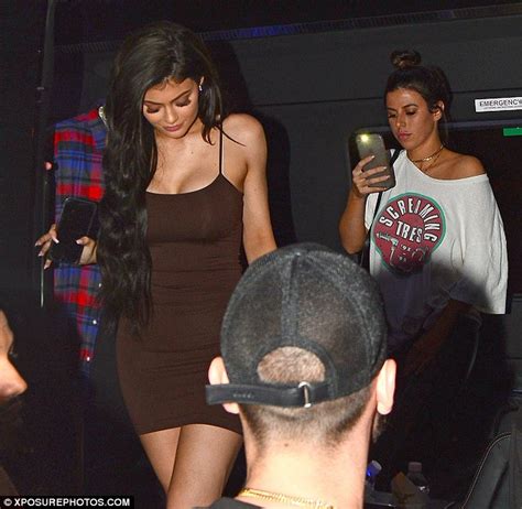 Kylie Jenner Flaunts Her Famous Curves In A Figure Hugging Brown Dress