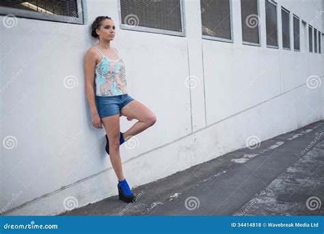 Attractive Woman Leaning Against A Wall Stock Photo Image Of View