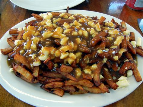 Poutine is a canadian dish of french fries and fresh cheese curds, covered with brown gravy or sauce. Poutine Chronicles: July 2014