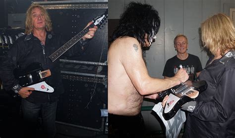 photos def leppard s joe elliott with his new smashed guitar paul stanley