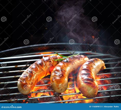 Grilled Sausages On Grill With Smoke And Flame Stock Image Image Of