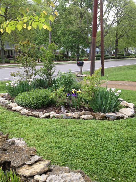 Dwarf conifers are an ideal addition to any rock garden. Island flower garden with rock border #diy #curbappeal # ...
