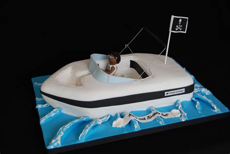 A Boat Shaped Cake On Top Of A Table