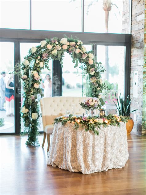 Here is where husband and wife sit as they enjoy their meals, drinks, and socialize with loved ones. Sweetheart Table with Greenery Arch - Elizabeth Anne ...