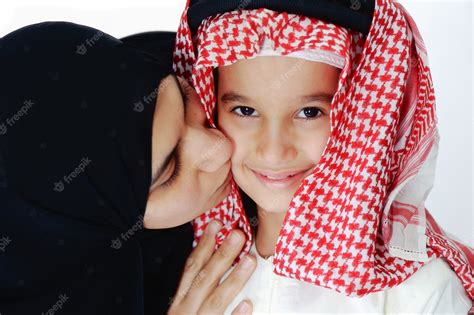 Premium Photo Arabic Muslim Mother Kissing Her Little Son