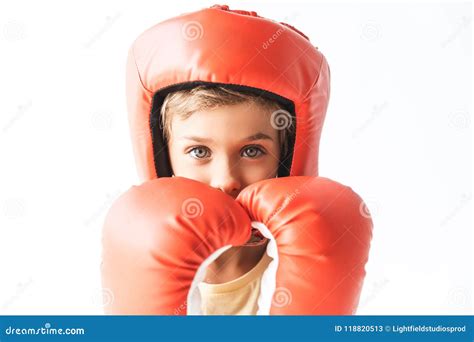 Little Boy In Red Boxing Gloves And Helmet Looking At Camera Stock