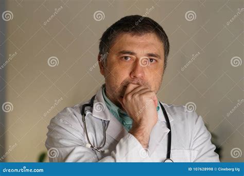 Portrait Of Male Doctor With Hand On Chin Stock Photo Image Of