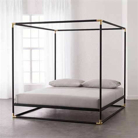 You can always rely upon a canopy bed to turn an ordinary room into a sumptuous refuge. Modern Canopy Beds | CB2 in 2020 | Metal canopy bed ...