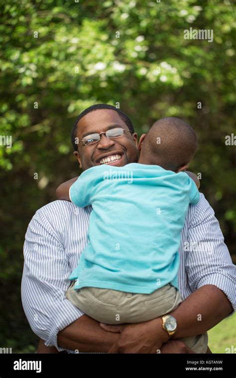 Father Hugging His His Son Stock Photo Alamy