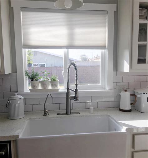 Make sure the wall dries completely before installing tiles! 8 DIY Peel-and-Stick Kitchen Backsplash Ideas | Taste of Home