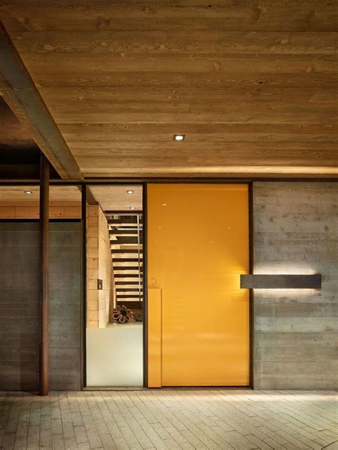 Contemporary wood doors are made with both stile and rail and flush construction. This modern mountain house is filled with industrial ...