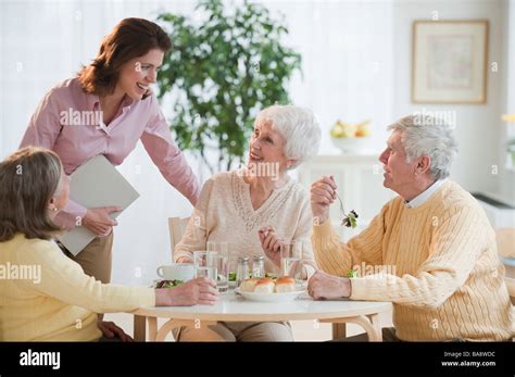 Senior Adults Eating Dinner Stock Photo Alamy